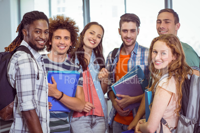 Fashion students smiling at camera together