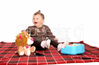 Baby having fun with her toys.