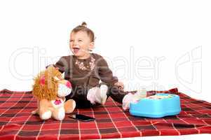 Baby having fun with her toys.