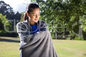 Pretty woman wrapped in blanket