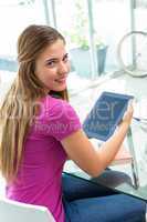 Beautiful young woman with digital tablet