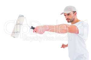 Handyman holding paint roller