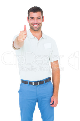 Happy male technician gesturing thumbs up