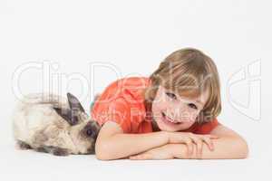 Cheerful boy with bunny on white background