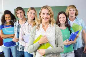 College students holding folders at college