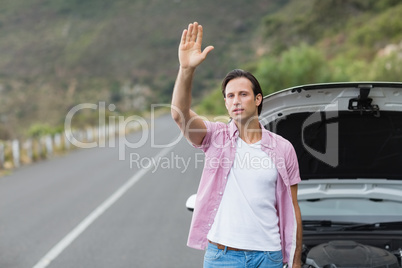 Man waving after a breakdown Man waving after a breakdown