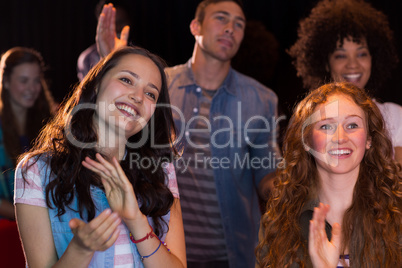 Young friends watching a film