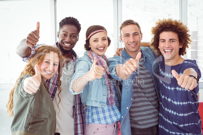 Fashion students smiling at camera together