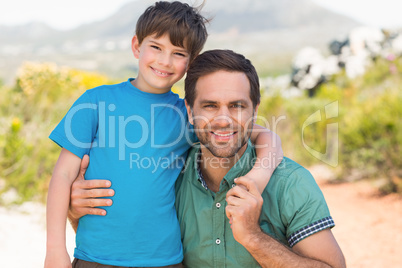 Father and son hiking through mountains