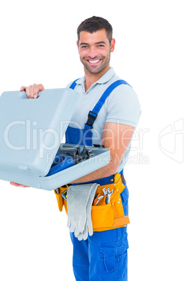 Portrait of happy repairman opening toolbox