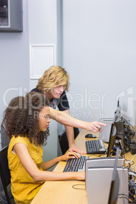 Students working on computer in classroom