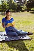 Pretty woman reading in the park