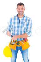 Portrait of confident repairman holding hammer