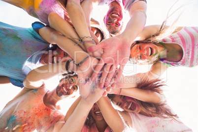 Happy friends covered in powder paint