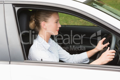 Businesswoman sitting in drivers seat