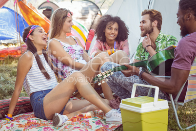 Hipsters having fun in their campsite