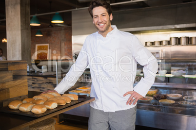 Smiling chef leaning on counter