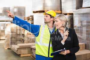 Warehouse worker and his manager working together