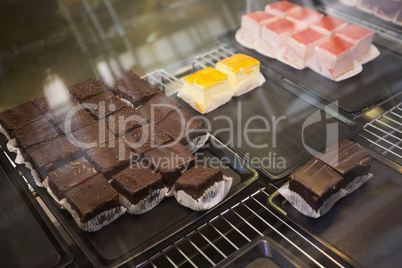 Display case with cheesecakes and brownies