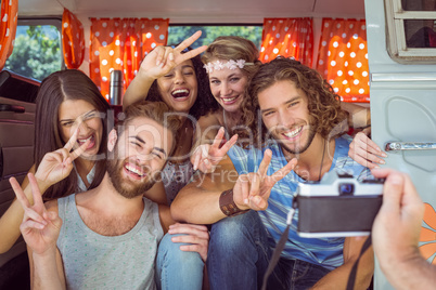 Hipster friends in a camper van