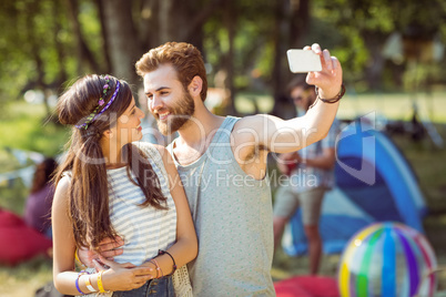 Hipster couple taking a selfie