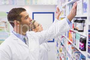 Team of pharmacists looking at medicine