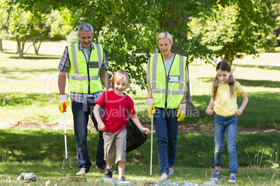 Happy family collecting rubbish