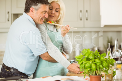 Mature couple preparing vegetarian meal together