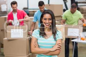 Portrait of a smiling volunteer with arms crossed