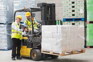 Forklift driver talking with his manager