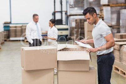 Warehouse manager checking his inventory