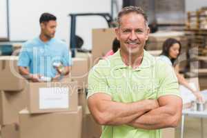 Portrait of a smiling volunteer with arms crossed