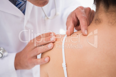 Doctor examining a spot at his patient