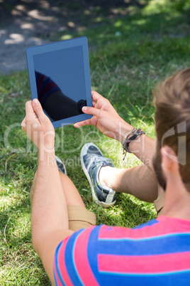 Man using tablet in the park