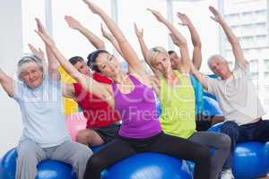 People exercising in gym class