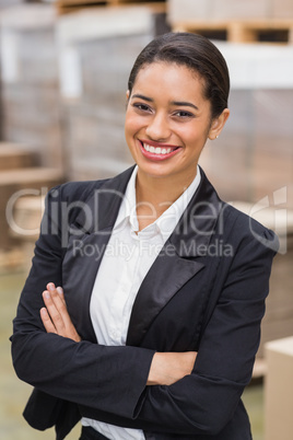 Warehouse manager smiling at camera