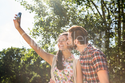 Hipster couple taking a selfie