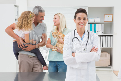 Smiling veterinarian looking at camera