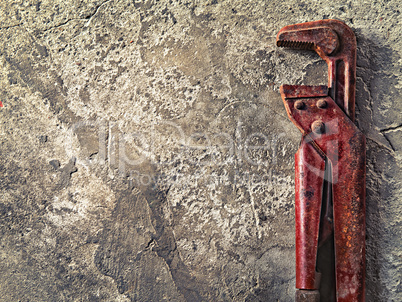 old wrench on concrete