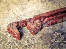 old wrench on concrete closeup