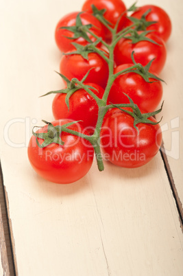 fresh cherry tomatoes on a cluster