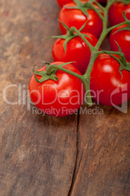 fresh cherry tomatoes on a cluster
