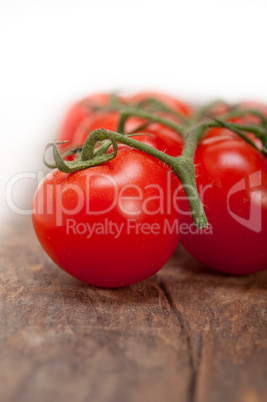 fresh cherry tomatoes on a cluster