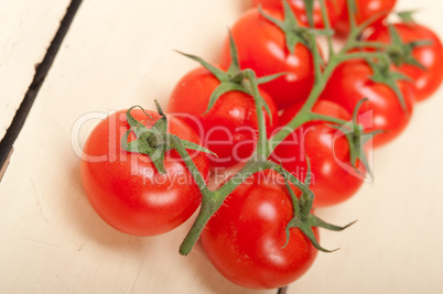 fresh cherry tomatoes on a cluster