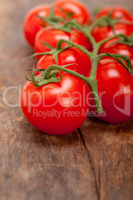 fresh cherry tomatoes on a cluster