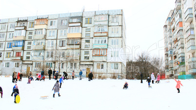 children are sleding from the hill