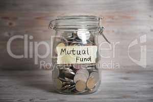 Money jar with mutual fund label.