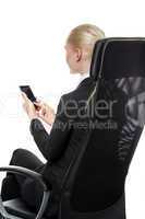 woman on a chair with mobile phone.