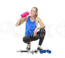 woman in fitness clothing drinking