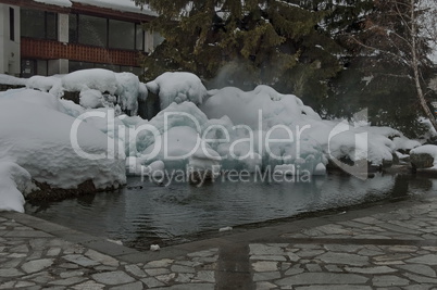 Frozen fountain with warm water